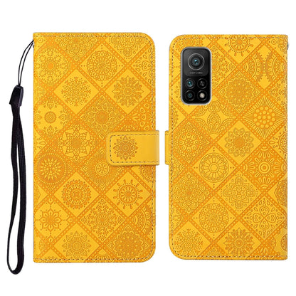 Mustard yellow embossed flip phone wallet case with card slots and wrist lanyard strap