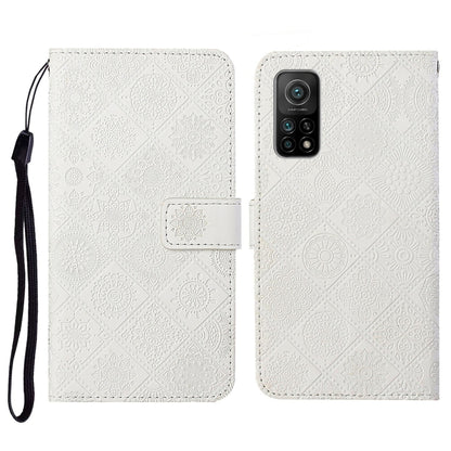 Embossed flip leather phone wallet case with card slot and wrist strap; white