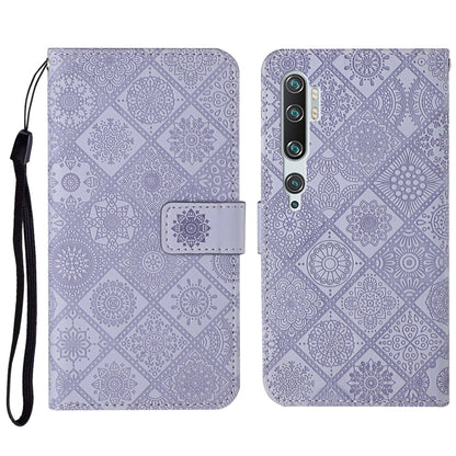 Purple embossed flip leather phone wallet case with card slots and lanyard strap