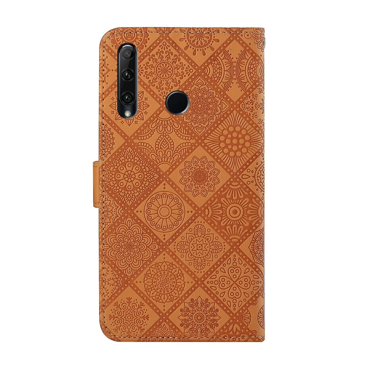 Brown embossed leather flip phone case with camera cutouts and fold-over wallet strap