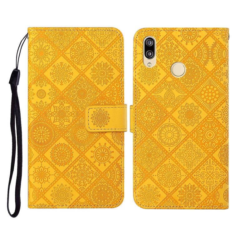 Yellow embossed folio leather phone case with flip cover, card slot, and wrist strap