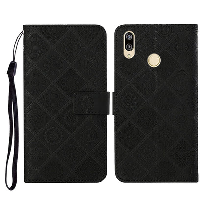 Black embossed folio leather phone case with flip cover, card slot, and wrist strap