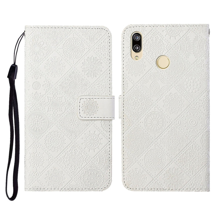 White embossed folio leather phone case with flip cover, card slot, and wrist strap