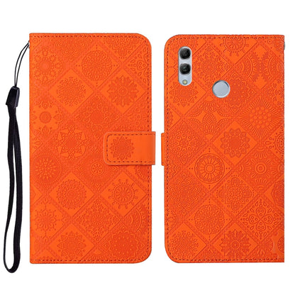 Orange embossed flip phone wallet case with wrist strap and card holder pocket