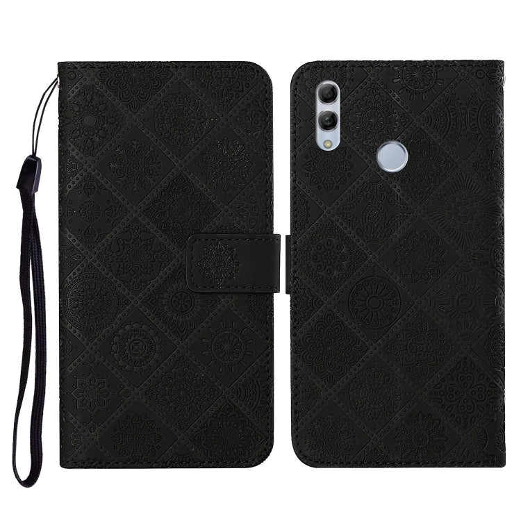 Black embossed flip phone wallet case with wrist strap and card holder slot