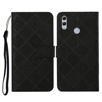 Black embossed flip phone wallet case with wrist strap and card holder slot