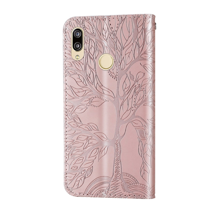 Rose gold embossed leather back flip phone case with camera cutouts and wrist strap