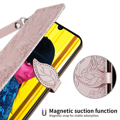 Rose gold embossed flip case with magnetic snap closure and wrist strap