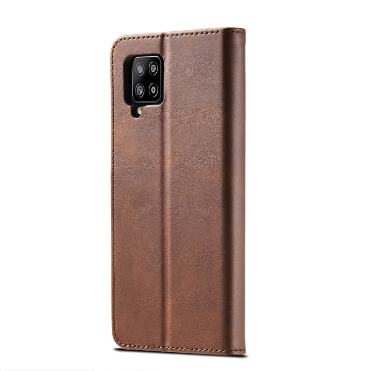 Brown leather flip phone case with cutouts and stitched edge; phone back camera area visible.