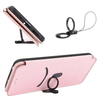 Pink carbon fiber magnetic flip phone case in stand position, side profile view