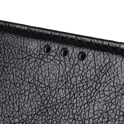 Close-up of black nappa leather texture with perforation details along the top edge