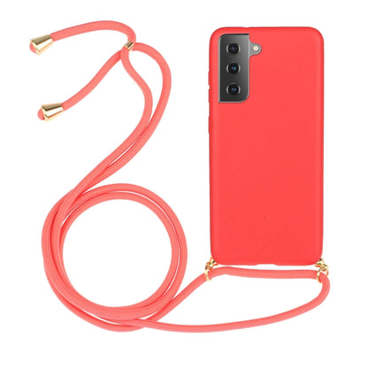 Red wheat-straw TPU phone case with coral-pink lanyard strap and gold-tone tips