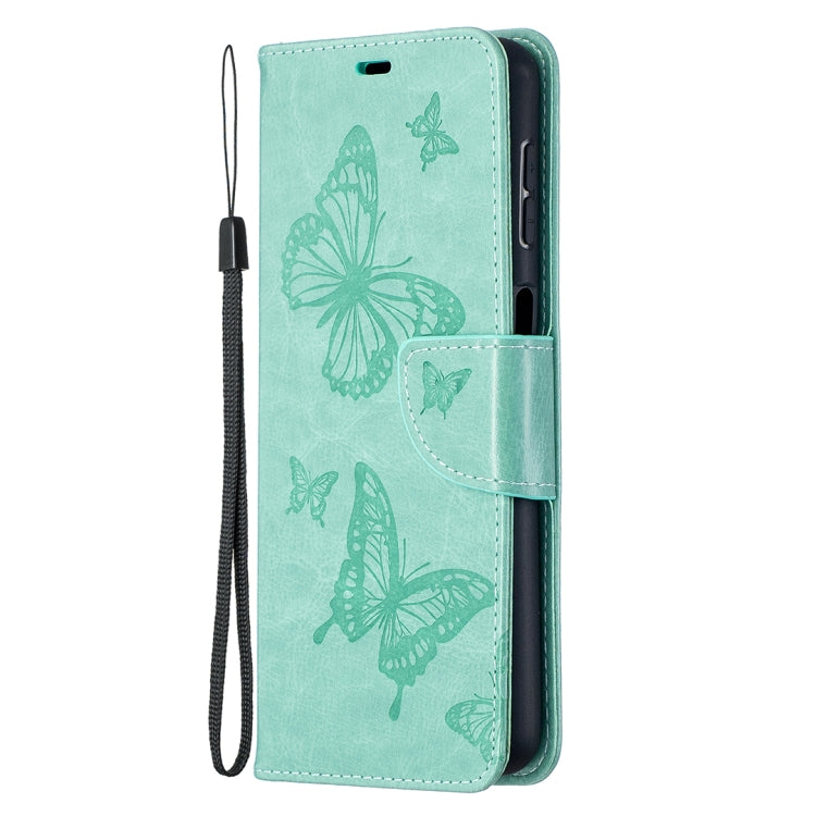Green PU leather wallet case with embossed butterflies and magnetic strap, phone side view