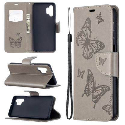 Embossed butterfly PU leather flip phone case in gray with lanyard and card slot wallet flap.