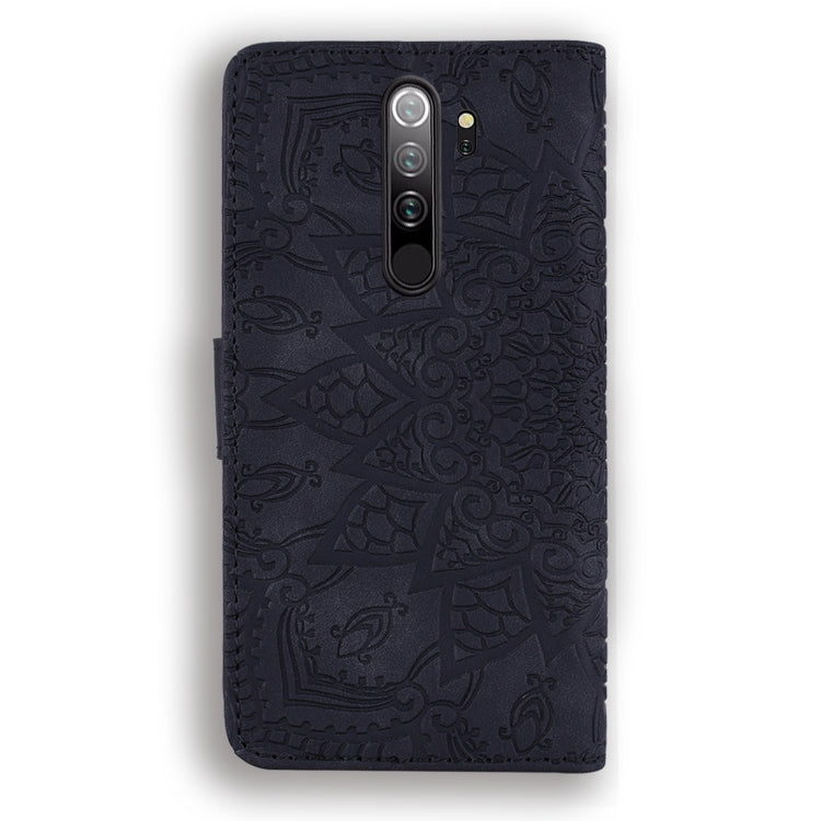 Dark embossed leather wallet case with mandala pattern and camera cutout