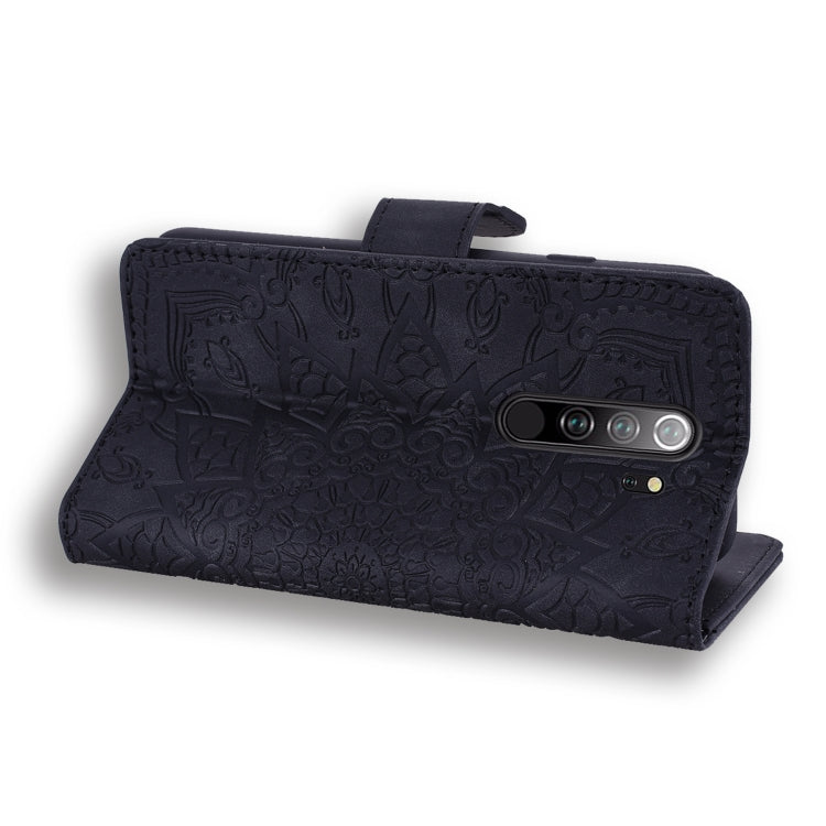 Dark embossed leather wallet case with mandala texture and flip-cover closure