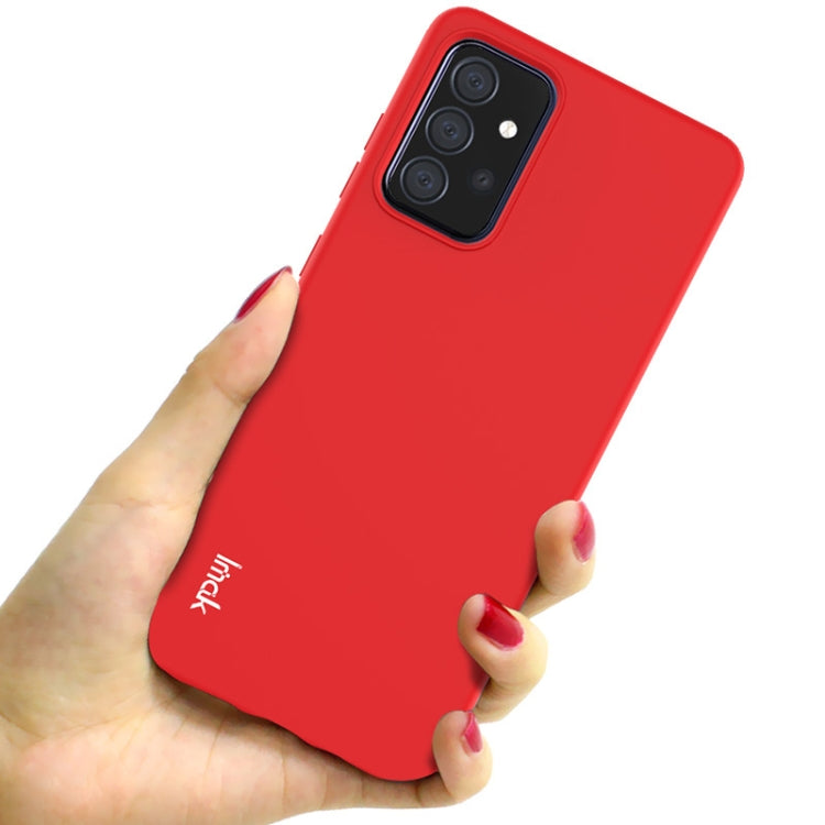 Red soft TPU phone case shown held in hand, full back with camera cutouts