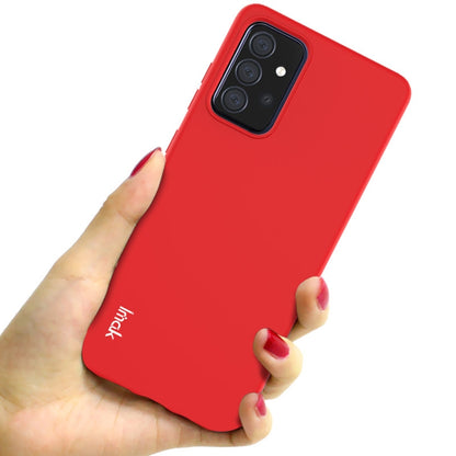 Red soft TPU phone case shown held in hand, full back with camera cutouts