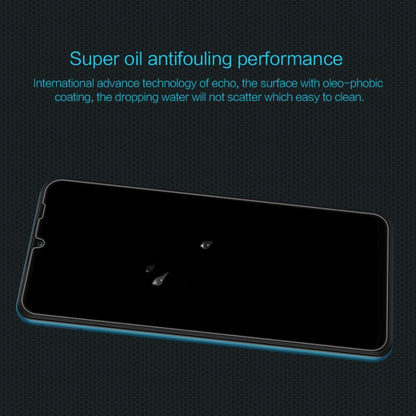 NILLKIN tempered glass screen protector film on smartphone with smooth black screen