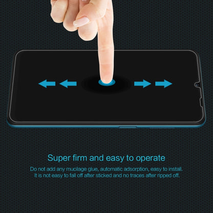 NILLKIN tempered glass screen protector film shown during finger installation