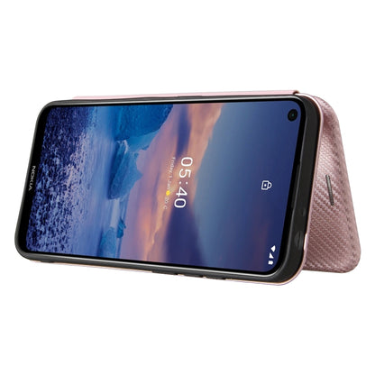Pink carbon-fiber texture flip case, phone in stand mode with screen visible