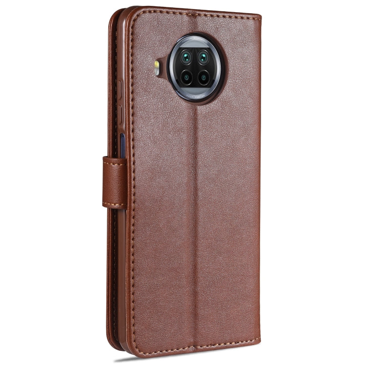 Brown flip leather phone case with camera cutout and side button openings