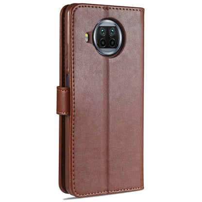 Brown flip leather phone case with camera cutout and side button openings