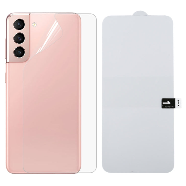Hydrogel rear screen protector film on a pink smartphone back, with extra sheet included
