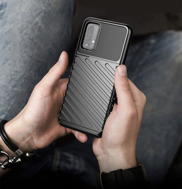 Shockproof TPU phone case for Redmi 9T, black ribbed case held in hands