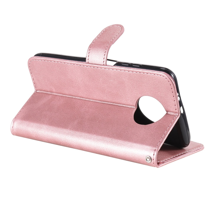 Rose gold flip leather phone case standing in landscape with camera cutout