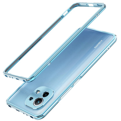 Light blue metal-framed phone case with lens protection, raised dual camera