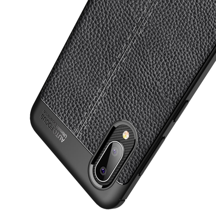 Black litchi-texture TPU case corner with camera opening and textured grip panel