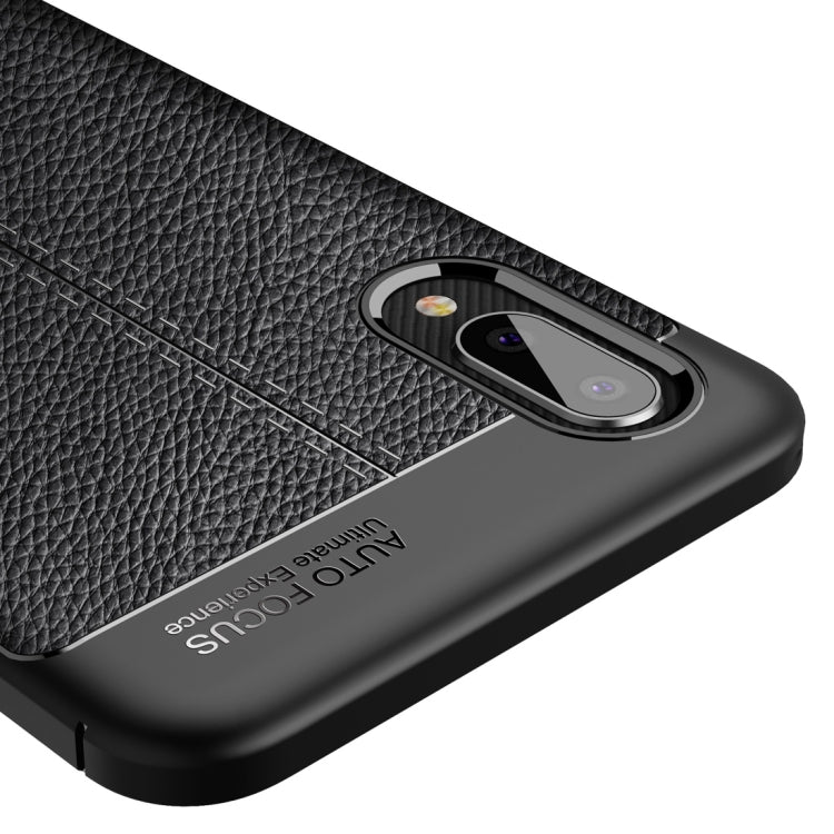 Black litchi-texture TPU phone case close-up of camera ring and back texture