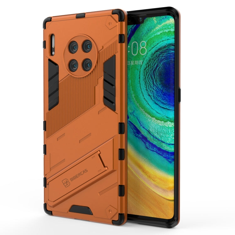 Orange and black shockproof phone case with rugged armor texture and camera cutouts.