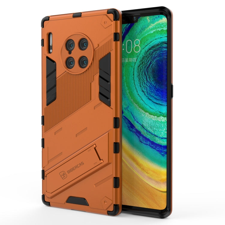 Orange and black rugged shockproof phone case with textured grip panels and camera cutouts.