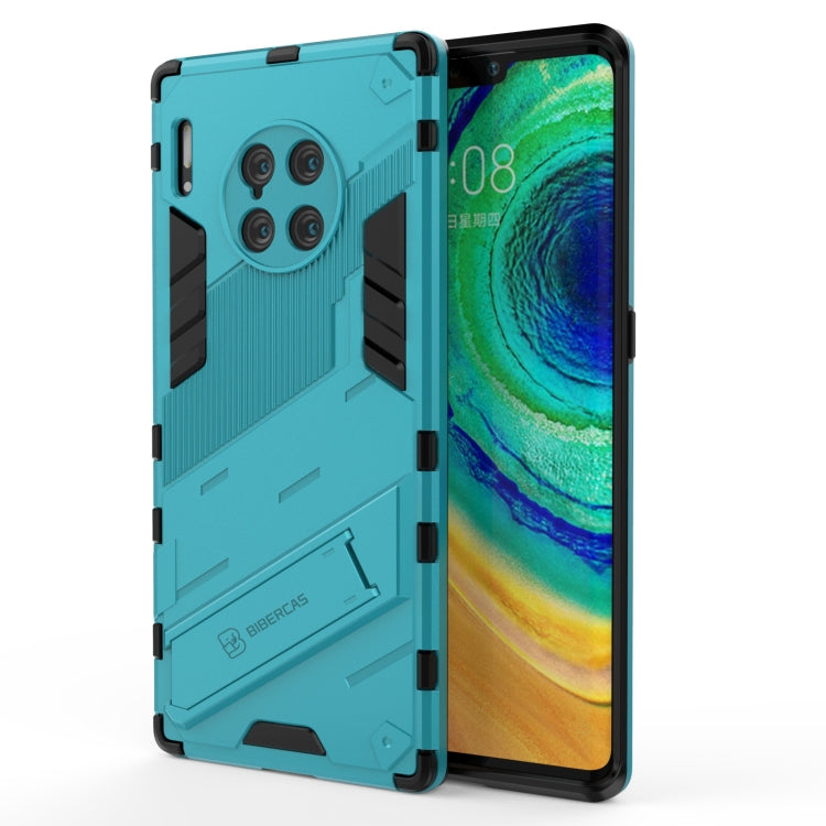 Turquoise rugged phone case with raised armor pattern and black corner bumpers