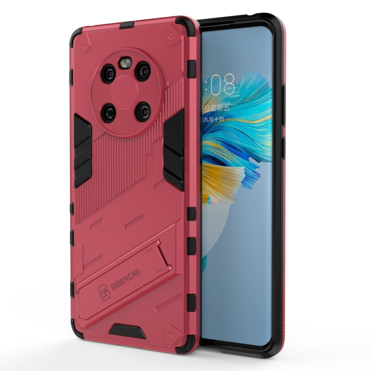 Red rugged phone case with armor texture and black side grips, open to show front