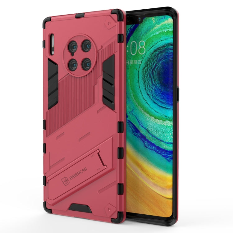 Red rugged phone case with raised armor pattern and black corner bumpers