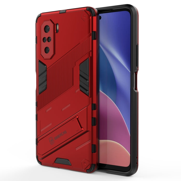Red armor-style phone case with diagonal ridges and accessible port openings