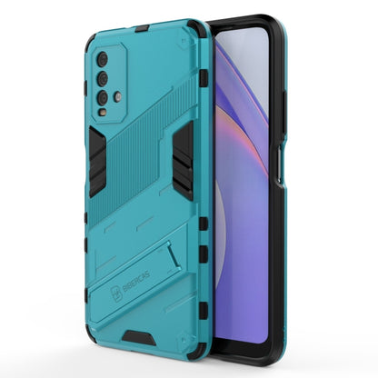 Rugged teal phone case with raised corners and textured back armor detailing
