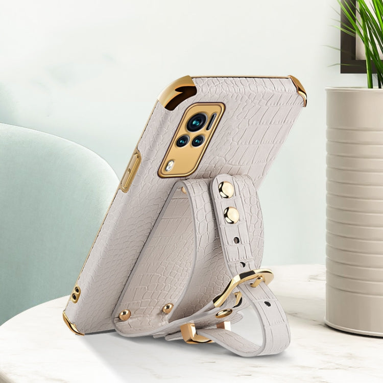 White croc-pattern TPU leather case with wrist strap, camera cutouts, side view