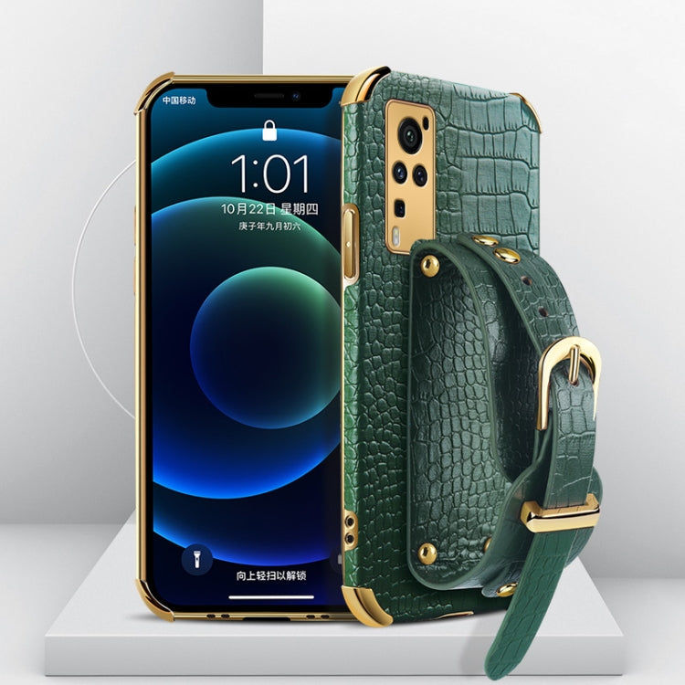 Smartphone case with crocodile pattern, electroplated finish, and wrist strap; teal/green