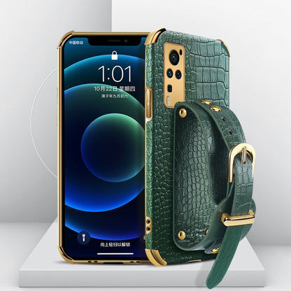 Smartphone case with crocodile pattern, electroplated finish, and wrist strap; teal/green