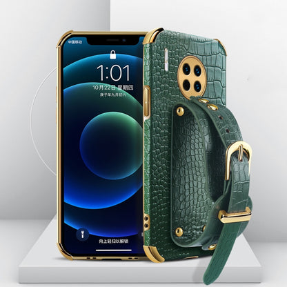 Green crocodile-pattern TPU phone case with wrist strap and gold camera hardware