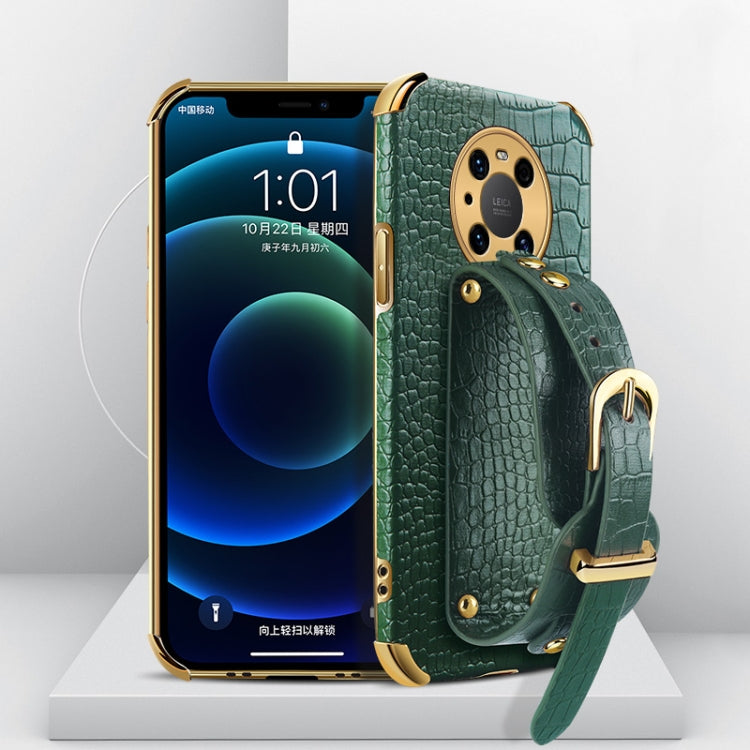 Green crocodile-textured TPU phone case with wrist strap and camera cutout, gold-tone hardware