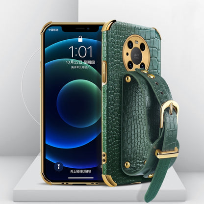 Green crocodile-textured TPU phone case with wrist strap and camera cutout, gold-tone hardware