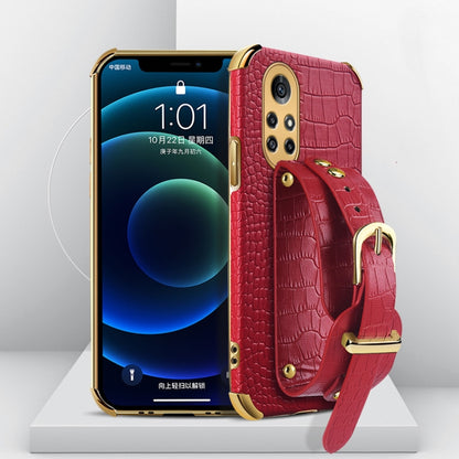 Electroplated TPU crocodile-pattern phone case with wrist strap, red (angled view)