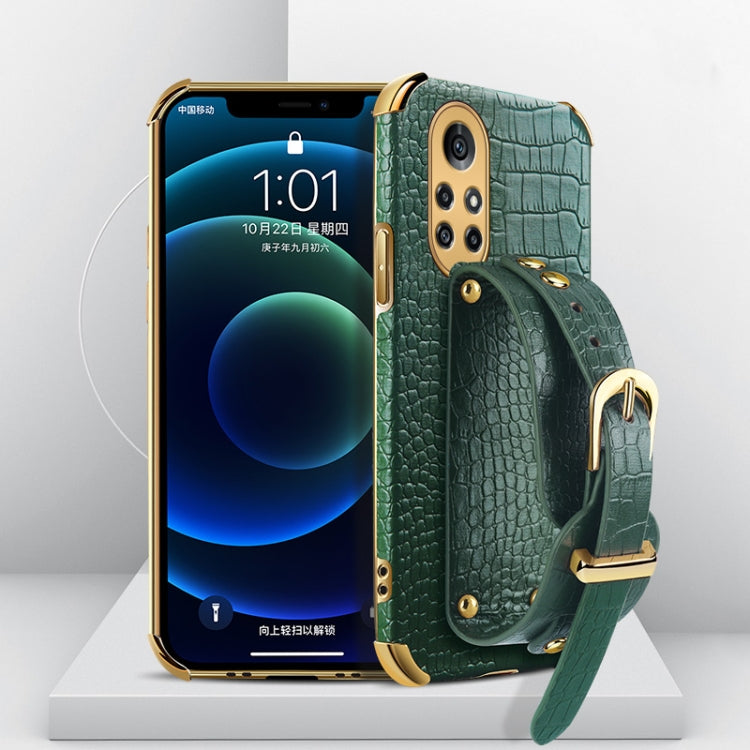 Electroplated TPU crocodile-pattern phone case with wrist strap, teal/green (angled view)