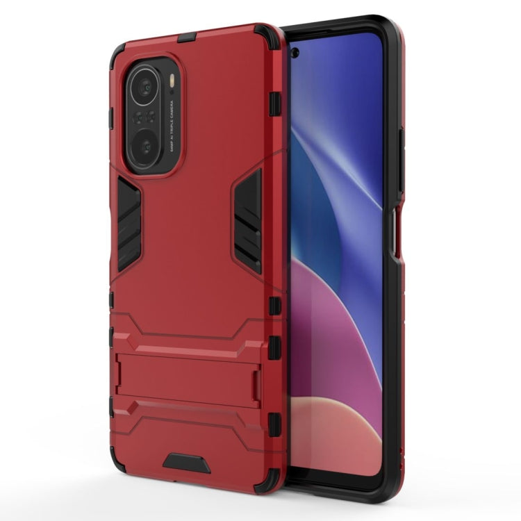 Shockproof red protective phone case with camera cutouts and raised edges
