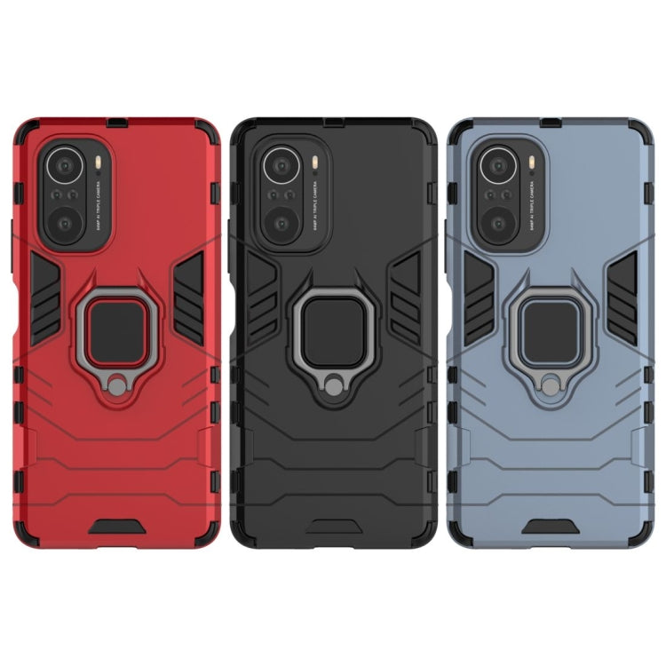 Shockproof phone case set in red, black, and blue, each with magnetic ring holder